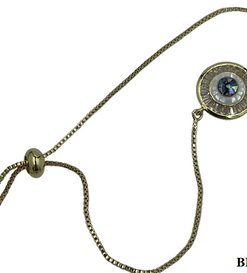 Bracelet- Round gold evil eye with clear and white crystals and green-blue eye